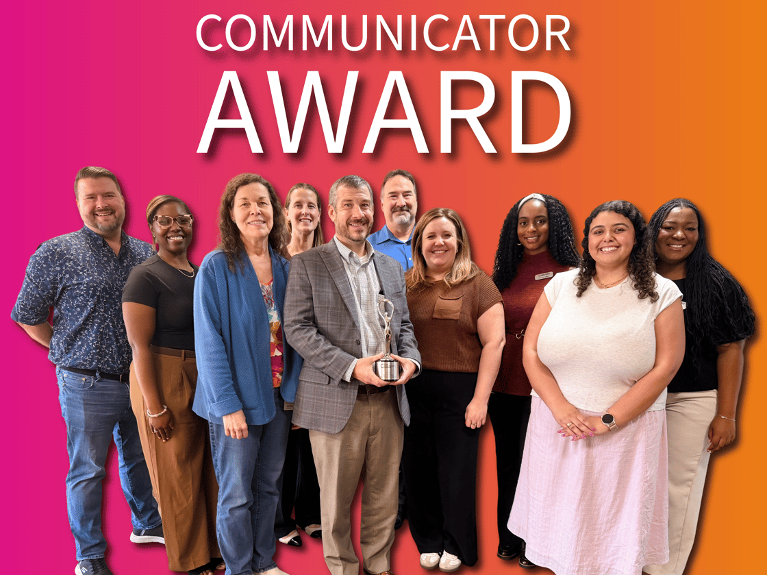 Members of Hollaway’s Communications and Creative Services teams presenting the Communicator Award trophy to project leads at the Harris County Flood Control District